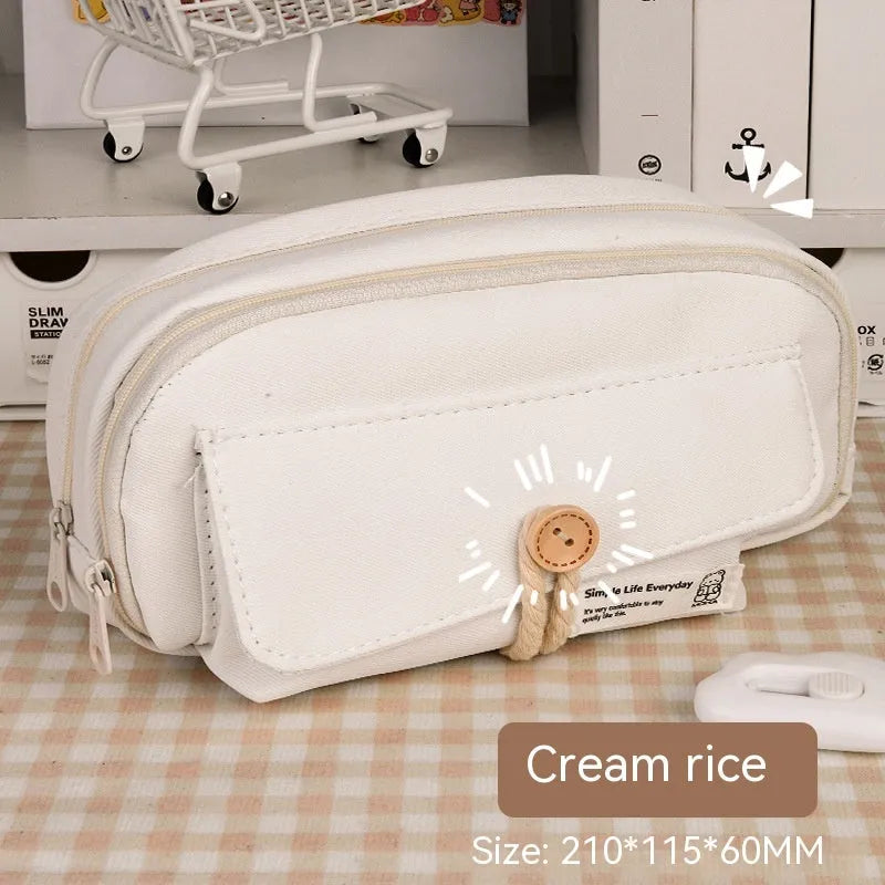 Green Korean-style canvas pencil case open, showing large capacity for pens and stationery.
