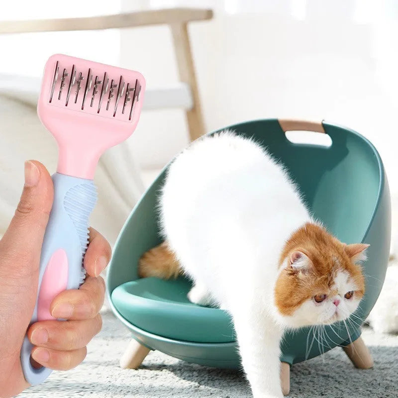 Stainless steel dog comb with knot knife edge and massage nodules, shown in pink colour option