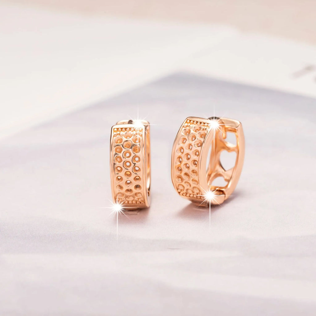 Rose gold hollowed-out heart-shaped earrings with three-layer openwork design