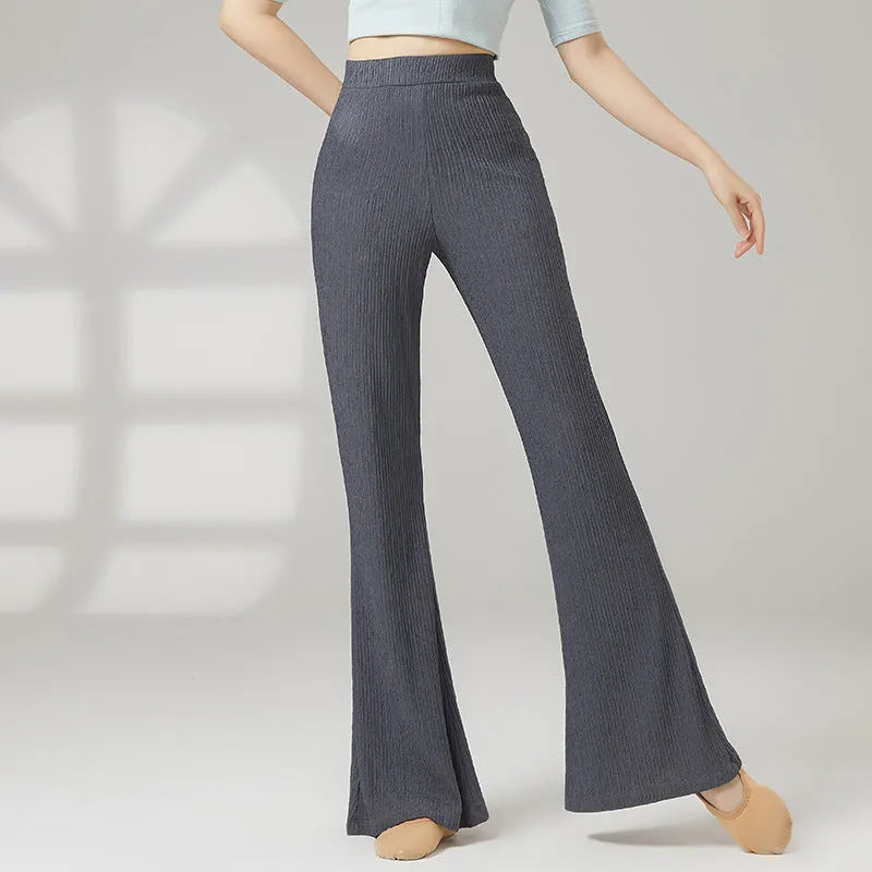 Women's solid colour dance practice pants in stretch polyester fabric on a hanger.