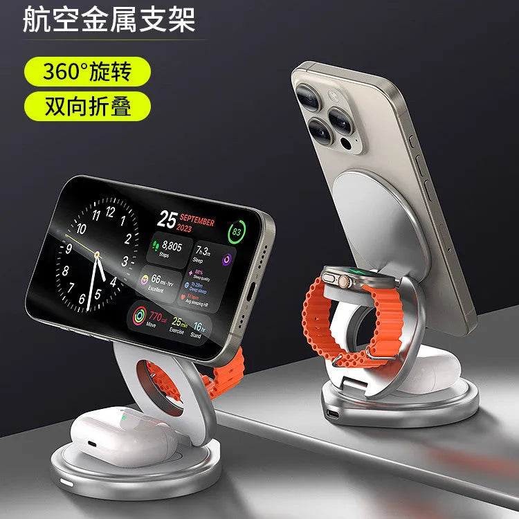 3-in-1 wireless charger magnetic folding stand in grey with phone and headphones charging on a desk