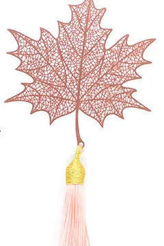 Brass metal bookmark with hollow leaf design and rose gold tassel in a presentation box.