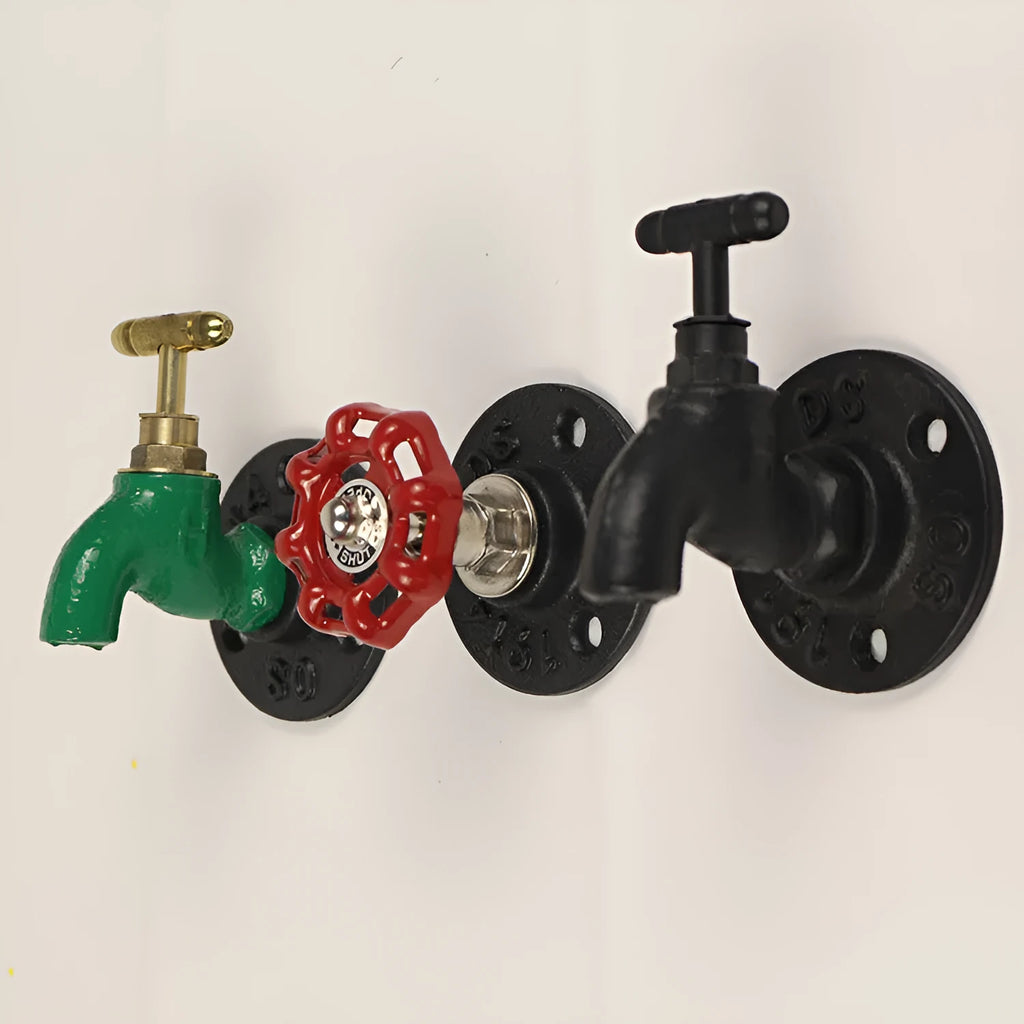 Modern minimalist metal towel rack hook mounted on a wall, shown in black faucet finish.
