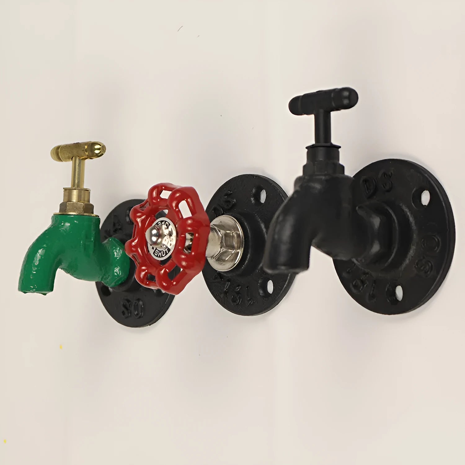 Modern minimalist metal towel rack hook mounted on a wall, shown in black faucet finish.