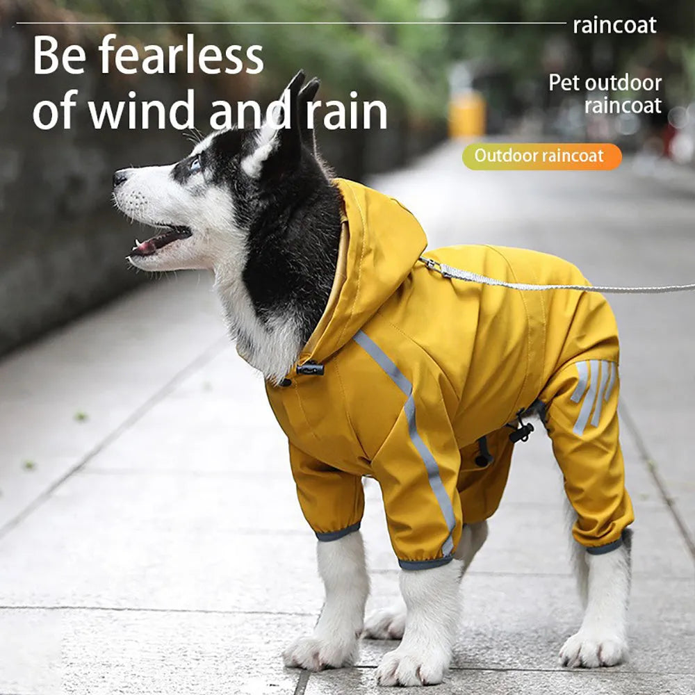 Waterproof dog raincoat with hood, reflective strips, and four-leg design on a small dog