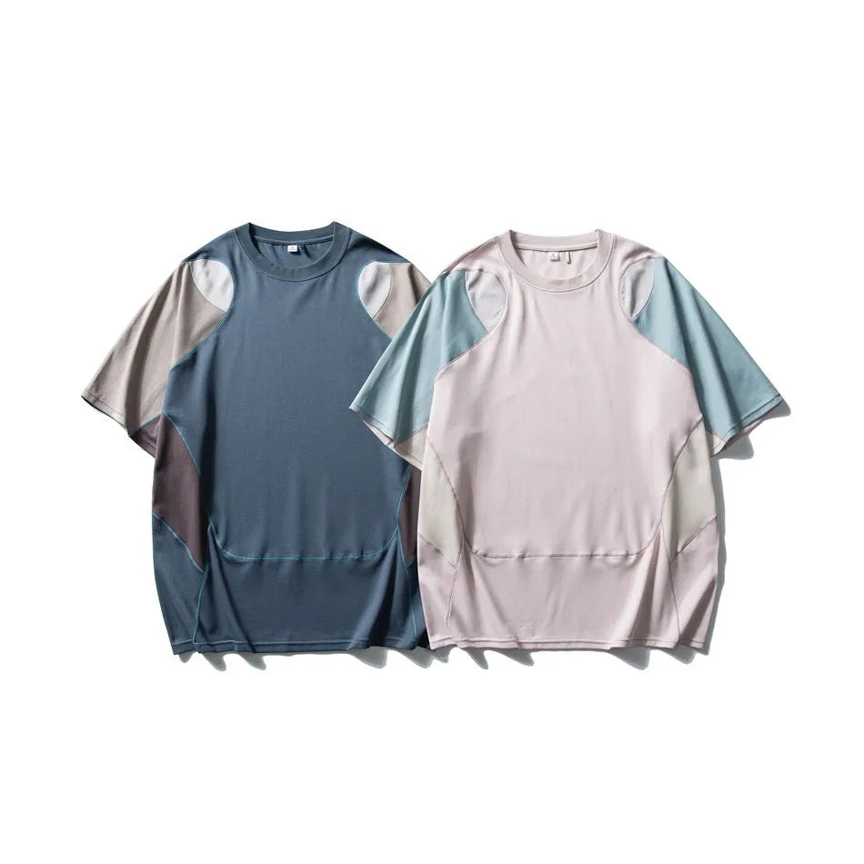 Men's loose blue patchwork short sleeve t-shirt on a hanger.