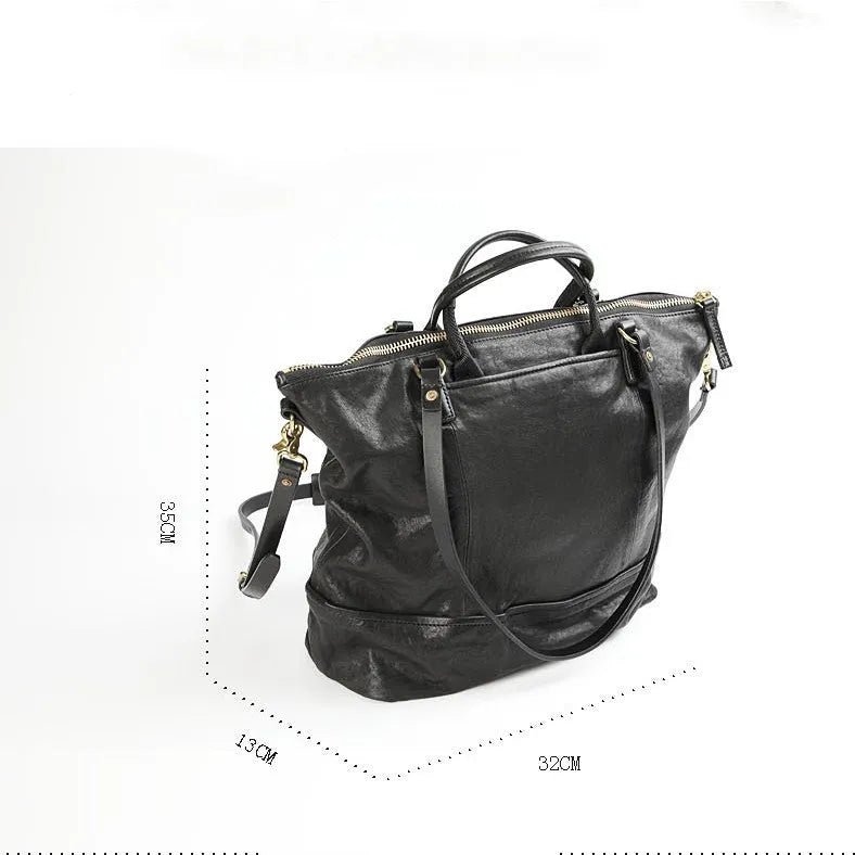 Black handmade vegetable tanned cowhide tote bag with zipper closure and large capacity for travel