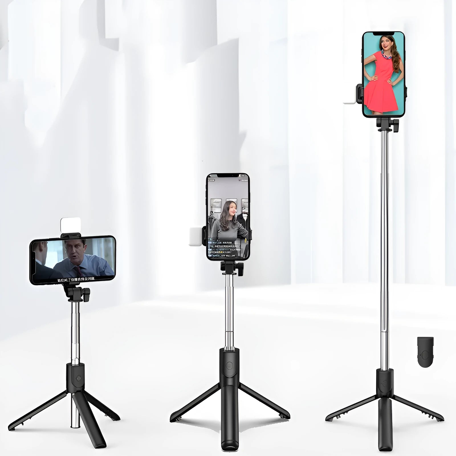 Black aluminium Bluetooth selfie stick tripod with integrated fill light and 360-degree rotating phone holder.