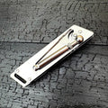 Heavy-duty folding stainless steel utility knife with neutral finish, closed position