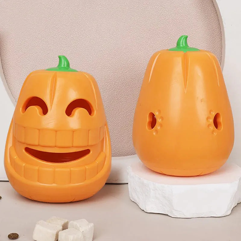 Halloween pumpkin shaped orange dog chew toy with treat-dispensing funnel opening