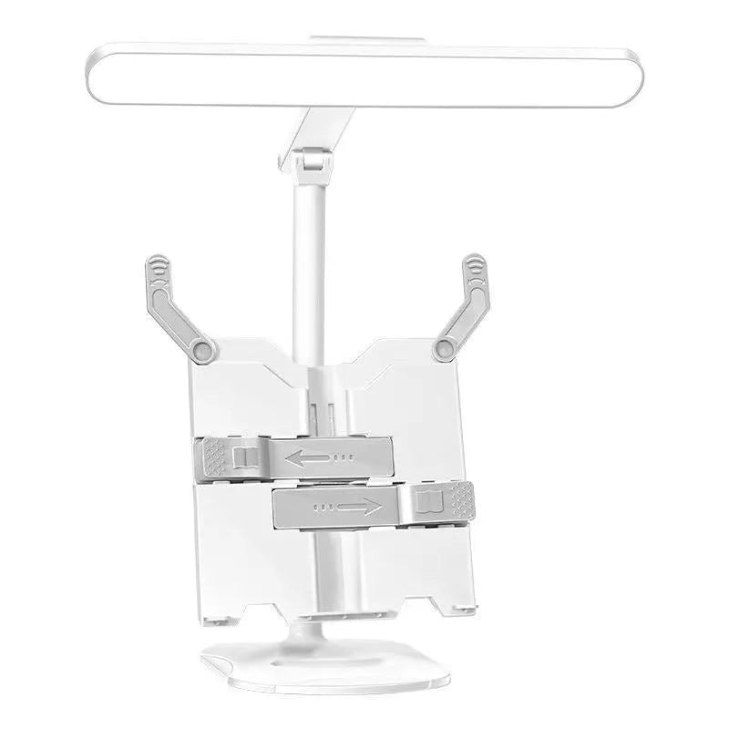 Adjustable multifunctional table lamp with an integrated bookshelf shelf on a wooden desk.