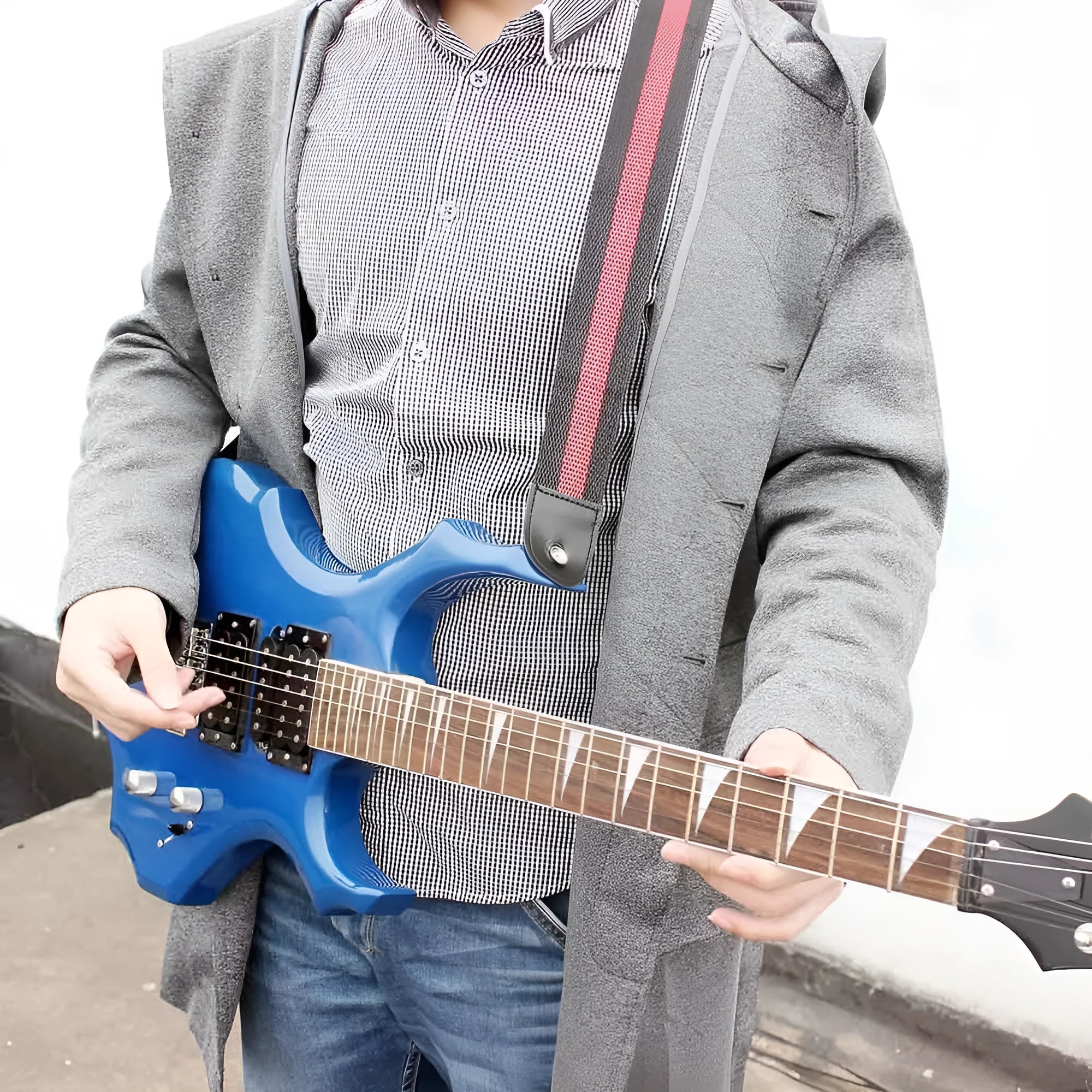 Woven striped crossbody guitar strap shown in multiple colours including army green, dark blue, red, white, and yellow.