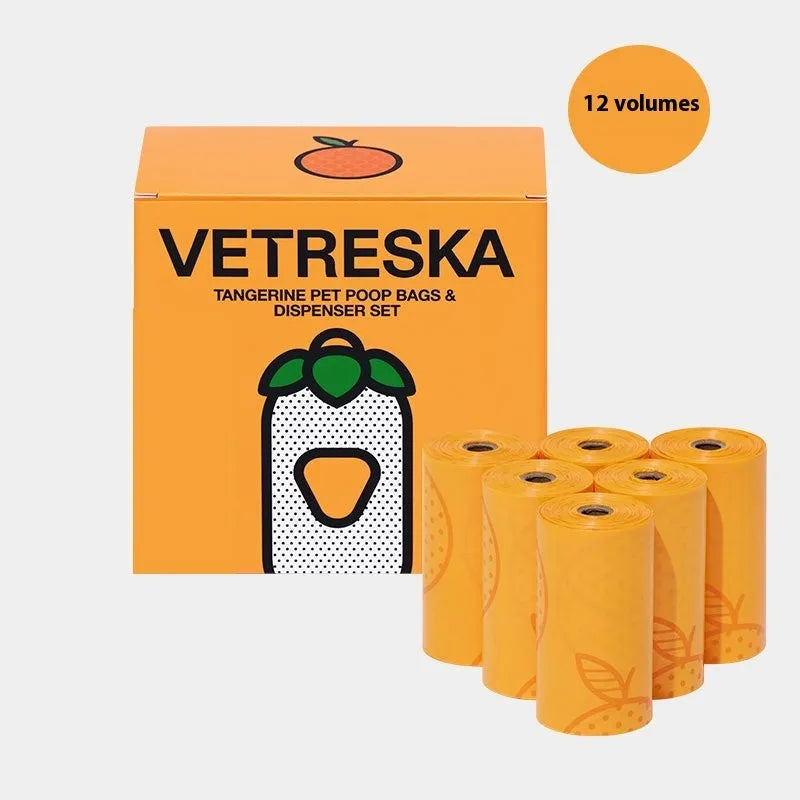 Portable plastic dog poop bag dispenser capsule with scented inner bags in strawberry, orange and cherry blossom colours