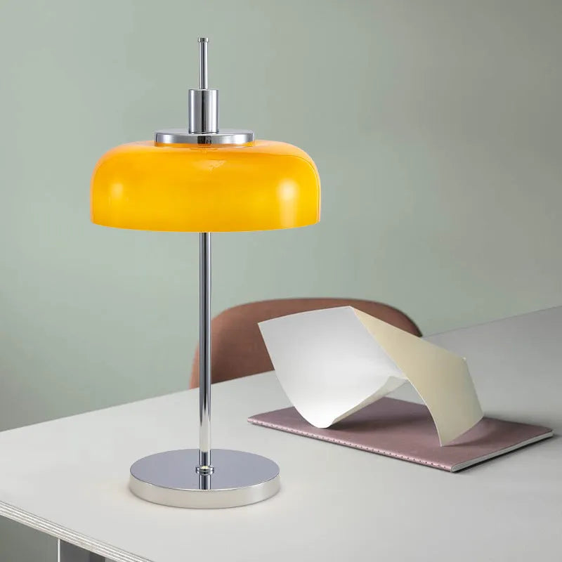 Retro table lamp with glass lampshade and chrome finish on a wooden surface