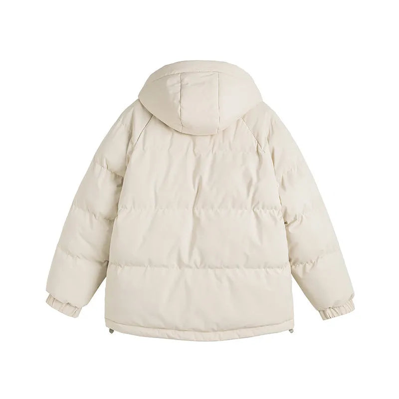 Loose-fitting solid-colour winter cotton-padded jacket with side pockets, shown on a hanger.