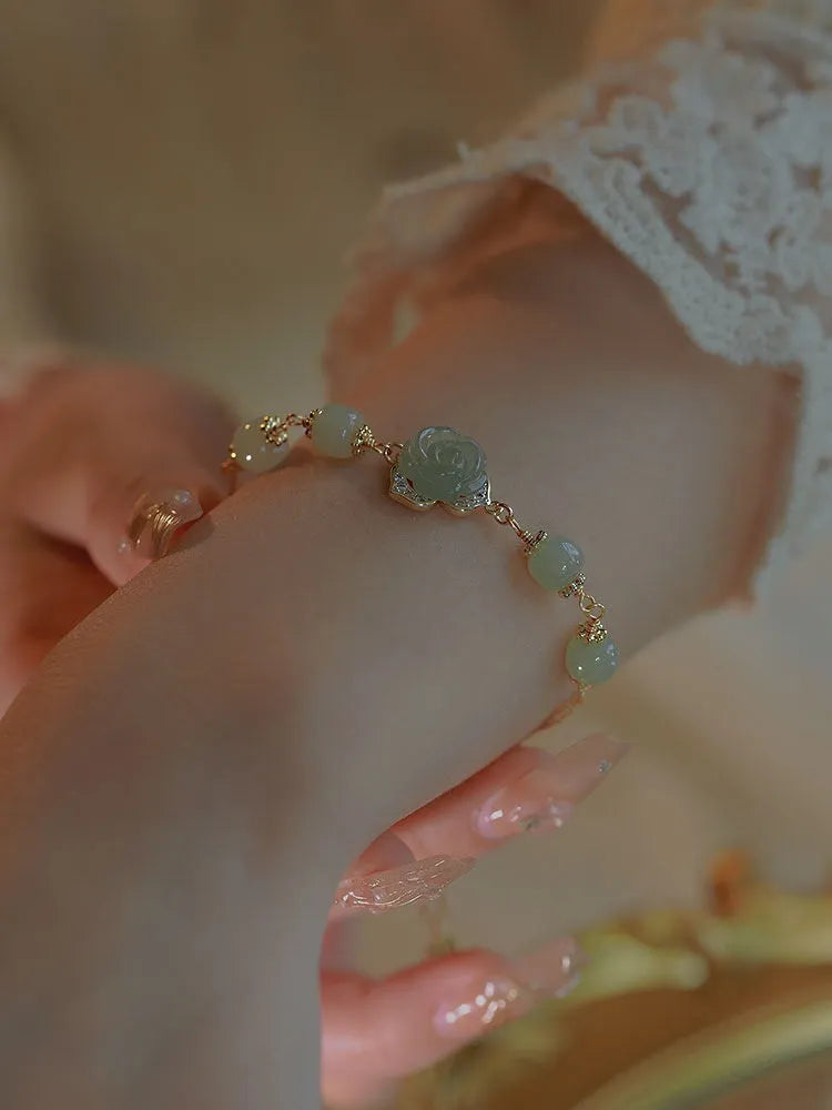 Original design women's bracelet in Hetian jade rose with 14K gilding and a flower shape.