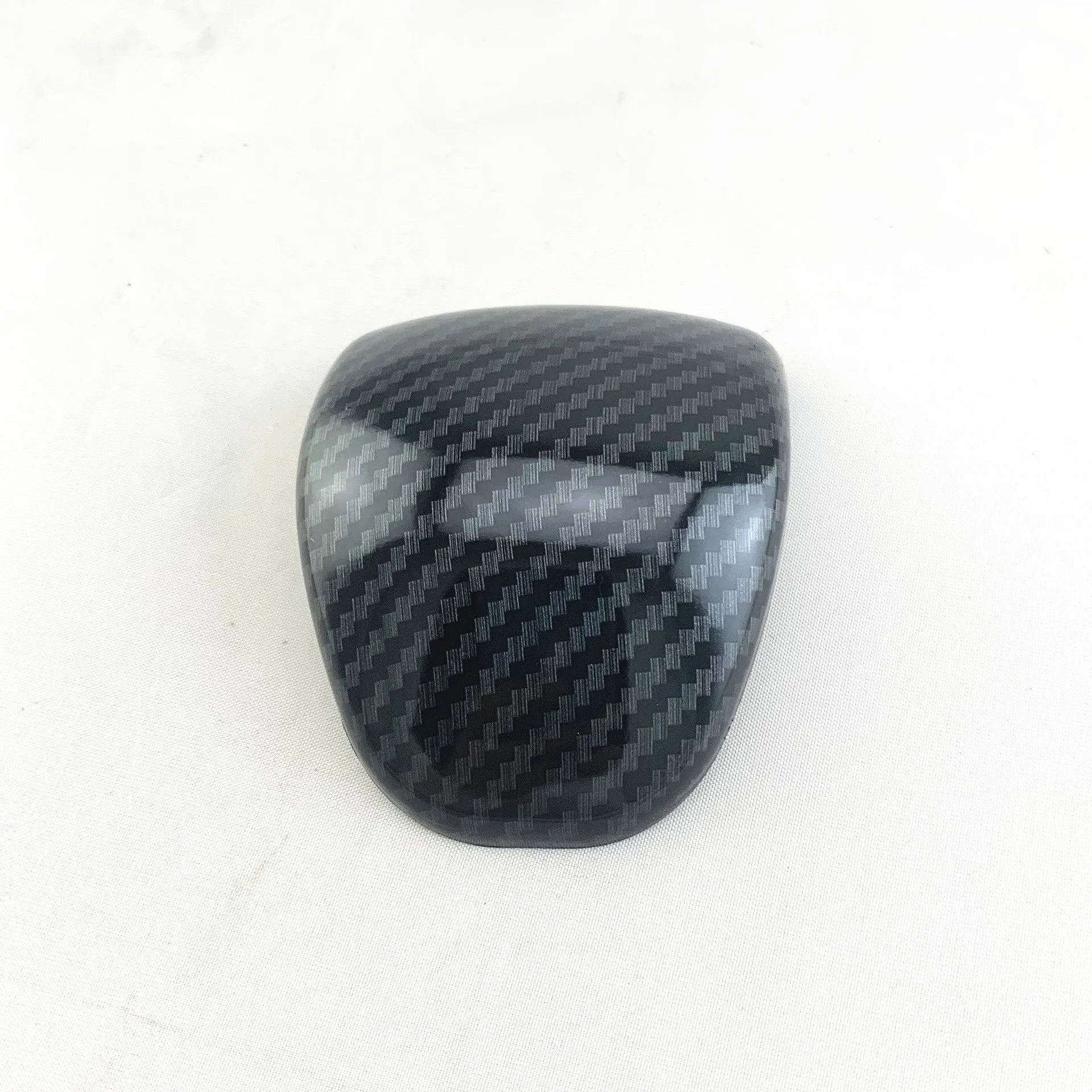 Smart RunK3 gear shift cover in carbon fibre pattern made from black ABS plastic.