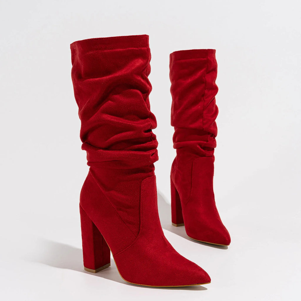 Women's black suede chunky heel boots with pointed toe and mid calf length.