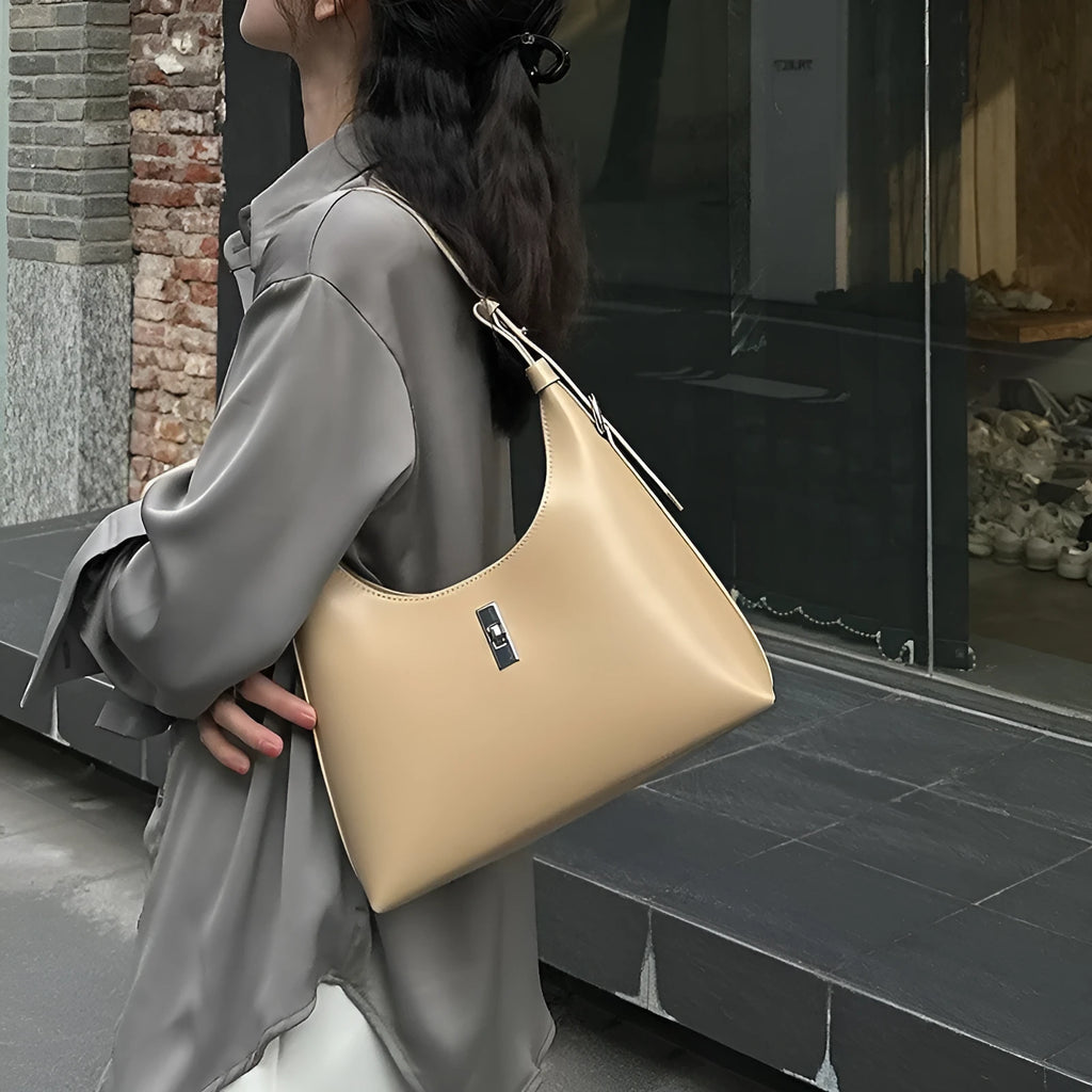 Genuine leather crossbody shoulder bag in dumpling shape with sandwich pocket design