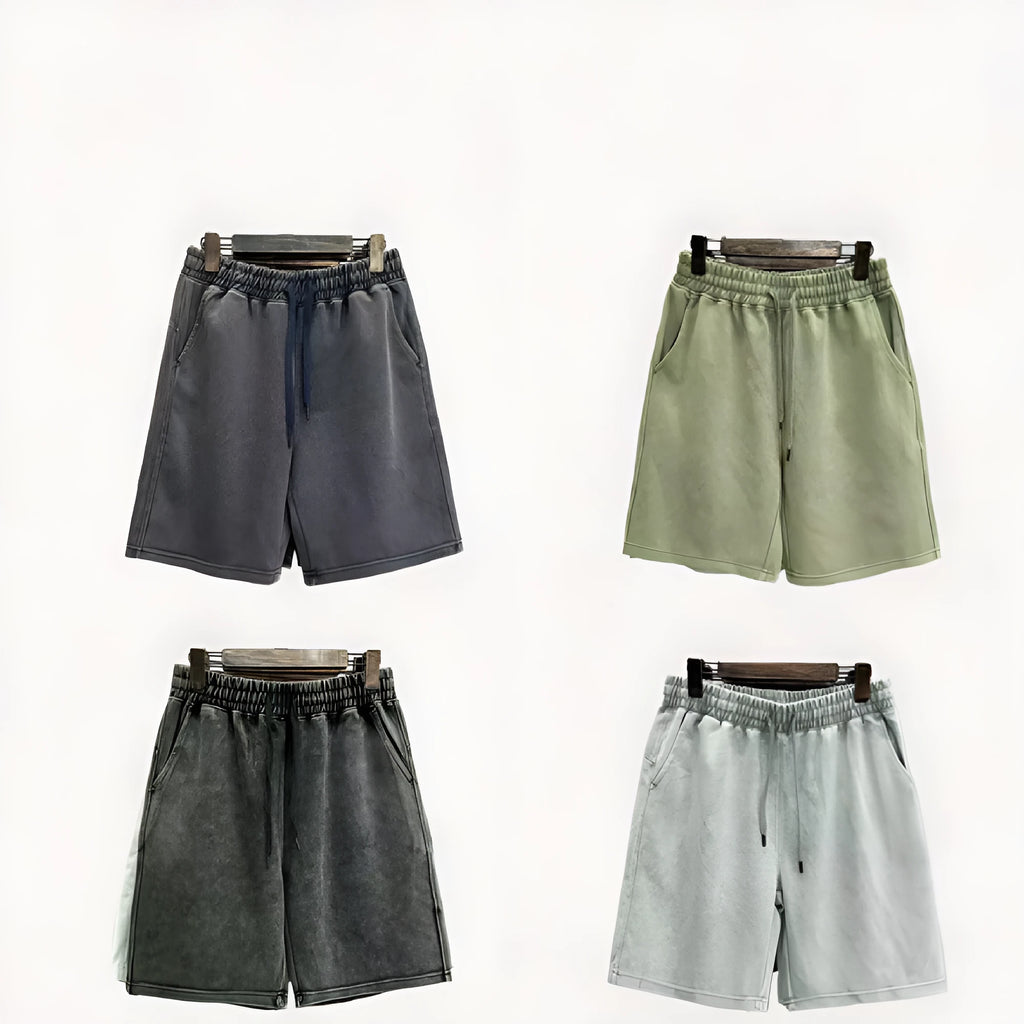 Men's charcoal black cotton shorts with a distressed style and loose straight-leg fit