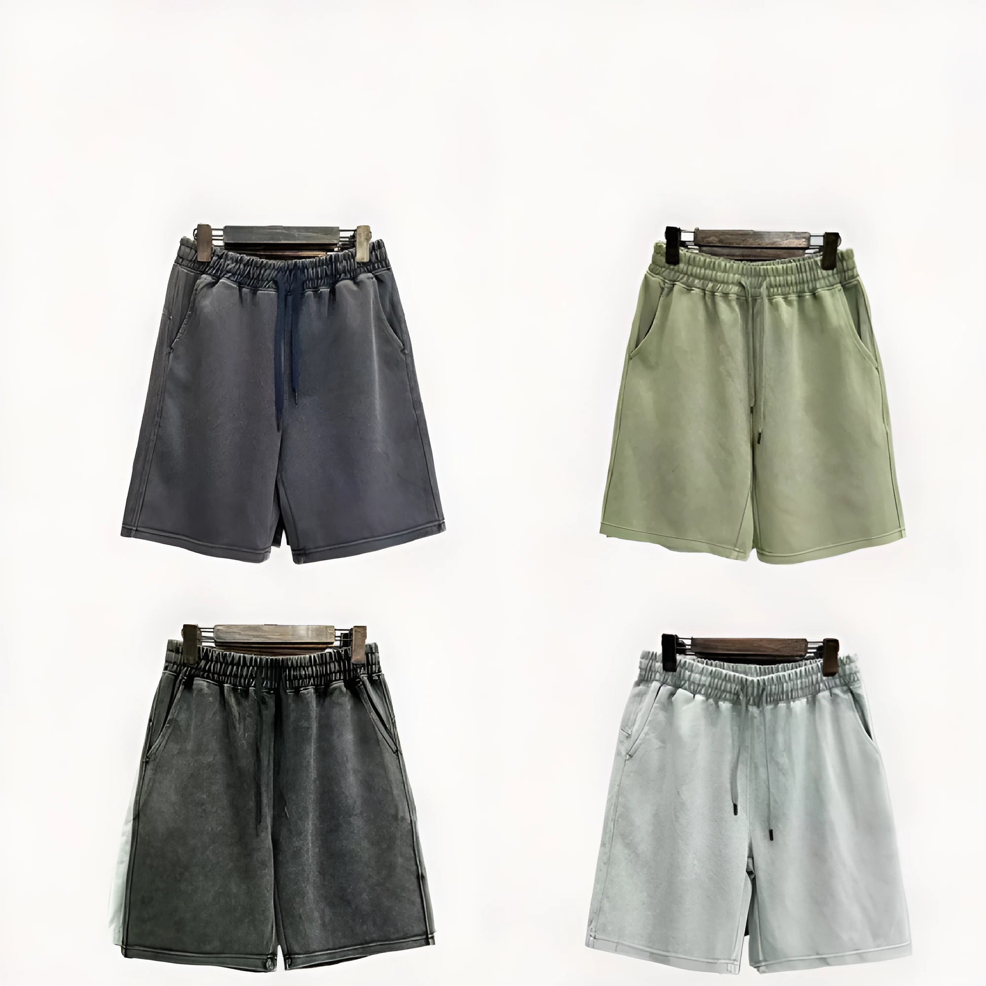 Men's charcoal black cotton shorts with a distressed style and loose straight-leg fit