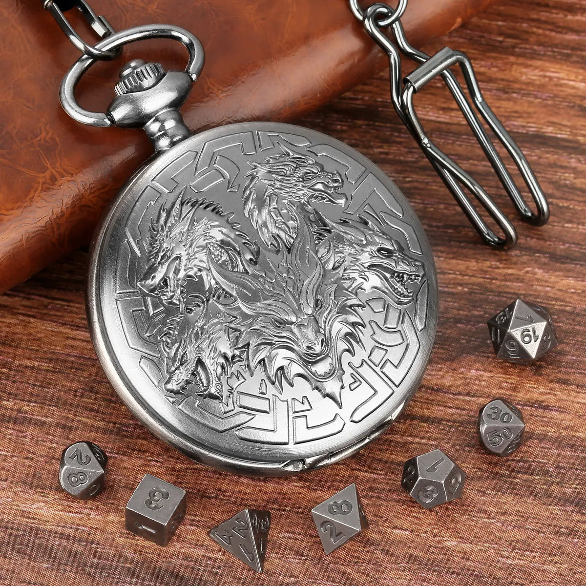 Steampunk pocket watch shaped dice set open revealing 7 polyhedral dice in zinc alloy bronze finish on dark background