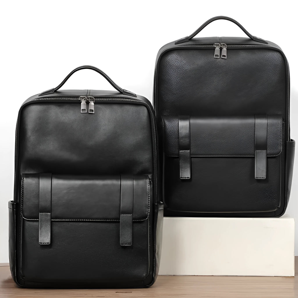 Men's black leather computer backpack showing front view with woven design elements