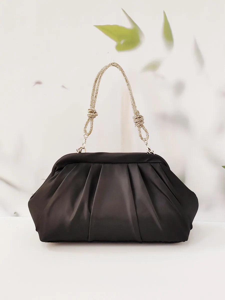 Women's soft shell-shaped polyester messenger bag in black with decorative chain and diamond details