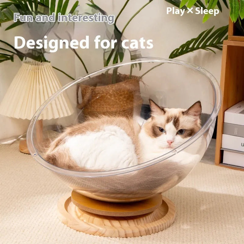 Transparent acrylic space capsule shaped cat bed on a turntable base, shown in a large size.