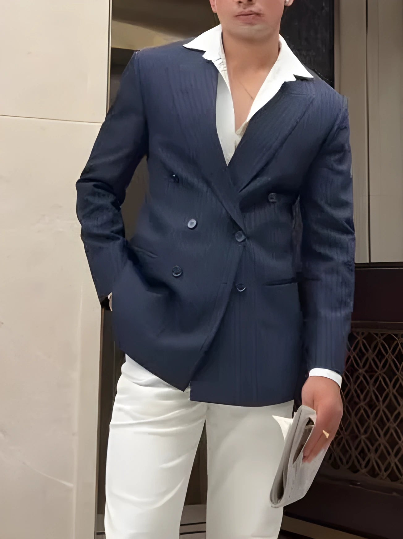 Men's striped double-breasted blazer on a hanger, showing regular fit and polyester construction.
