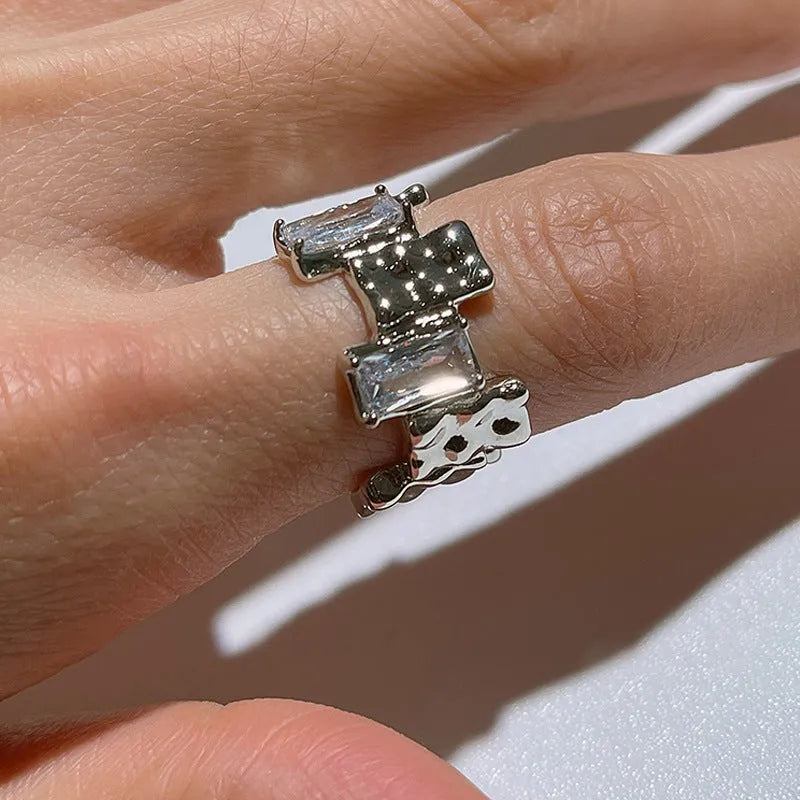 Silver geometric cross ring with zircon detailing and open pastoral retro design