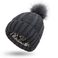 Wool knit beanie hat with satin lining and faux fur pom pom in multiple colours