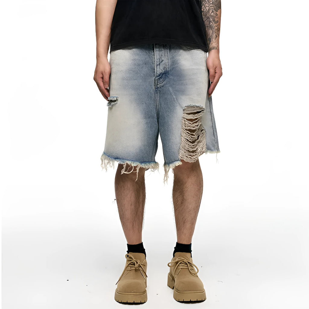 Light blue men's baggy denim shorts with a washed finish and zipper fly on a mid waist.