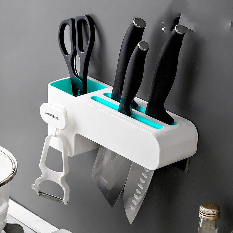 White plastic kitchen knife rack with modern simple design on countertop holding several knives
