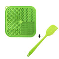 Blue silicone dog licking mat with suction cups on a smooth surface