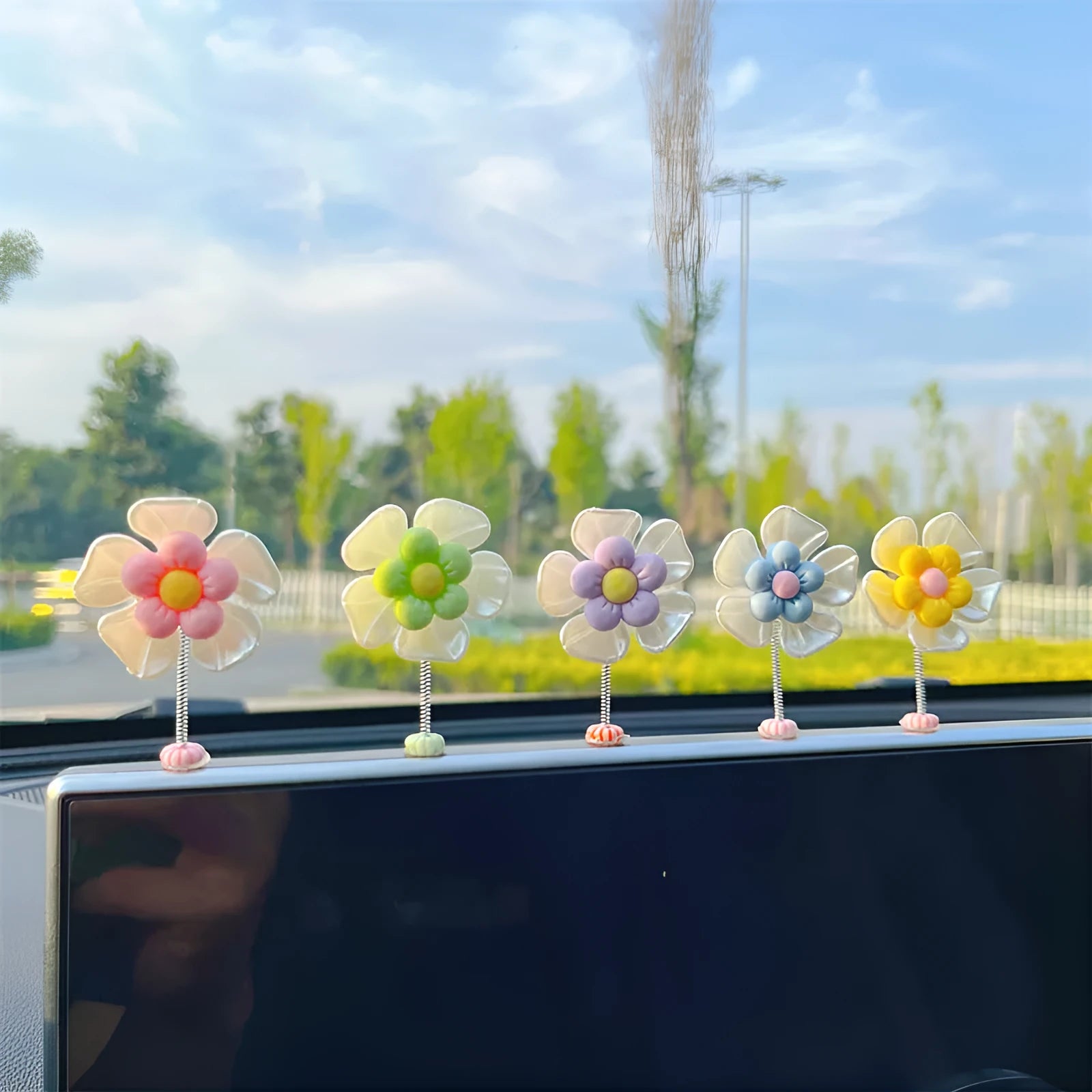 Colourful plastic swing car decoration measuring 5cm tall