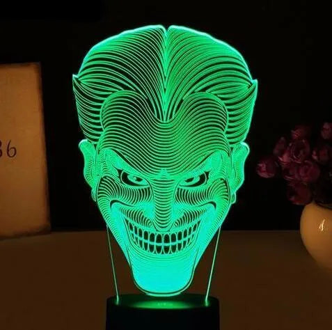 USB-powered acrylic 3D LED table lamp displaying blue light on a desk