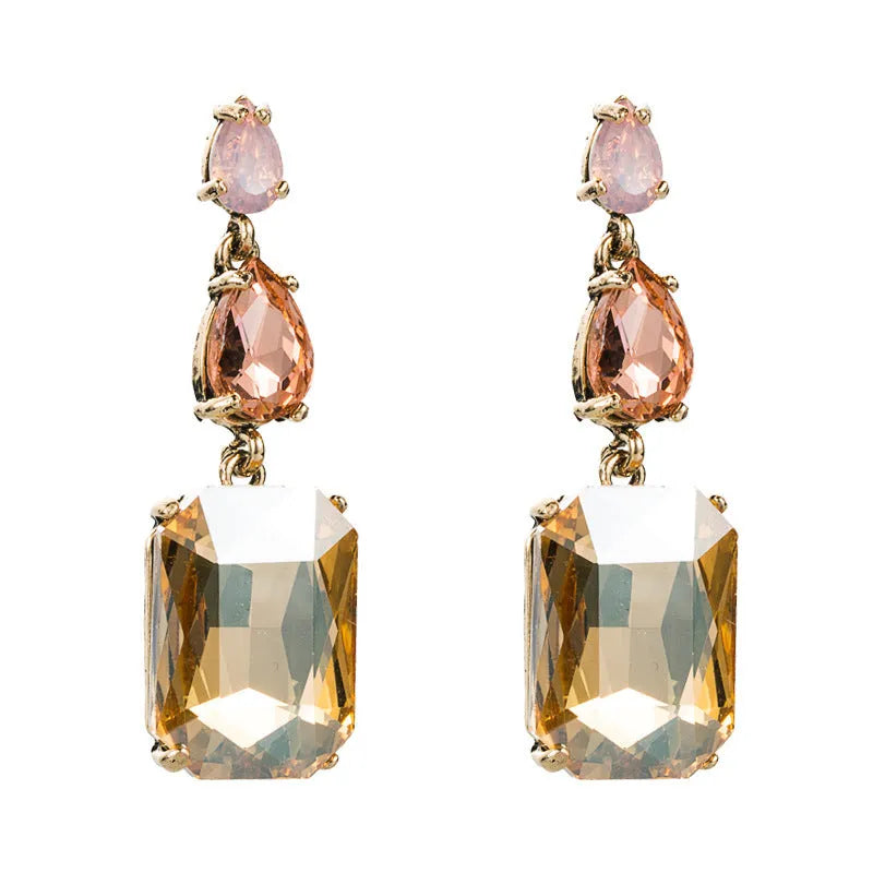 Geometric rhinestone earrings in a minimalist design with round shape, available in three colours