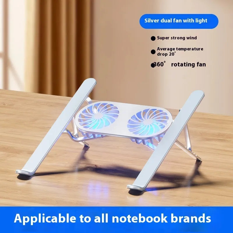 Silver aluminium alloy laptop cooling stand with dual fans in a raised, open position on a desk.