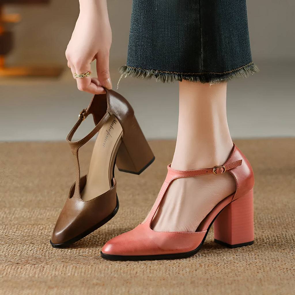 Women's dark brown retro pointed Mary Jane shoes with a hollow toe design and a buckle fastening.