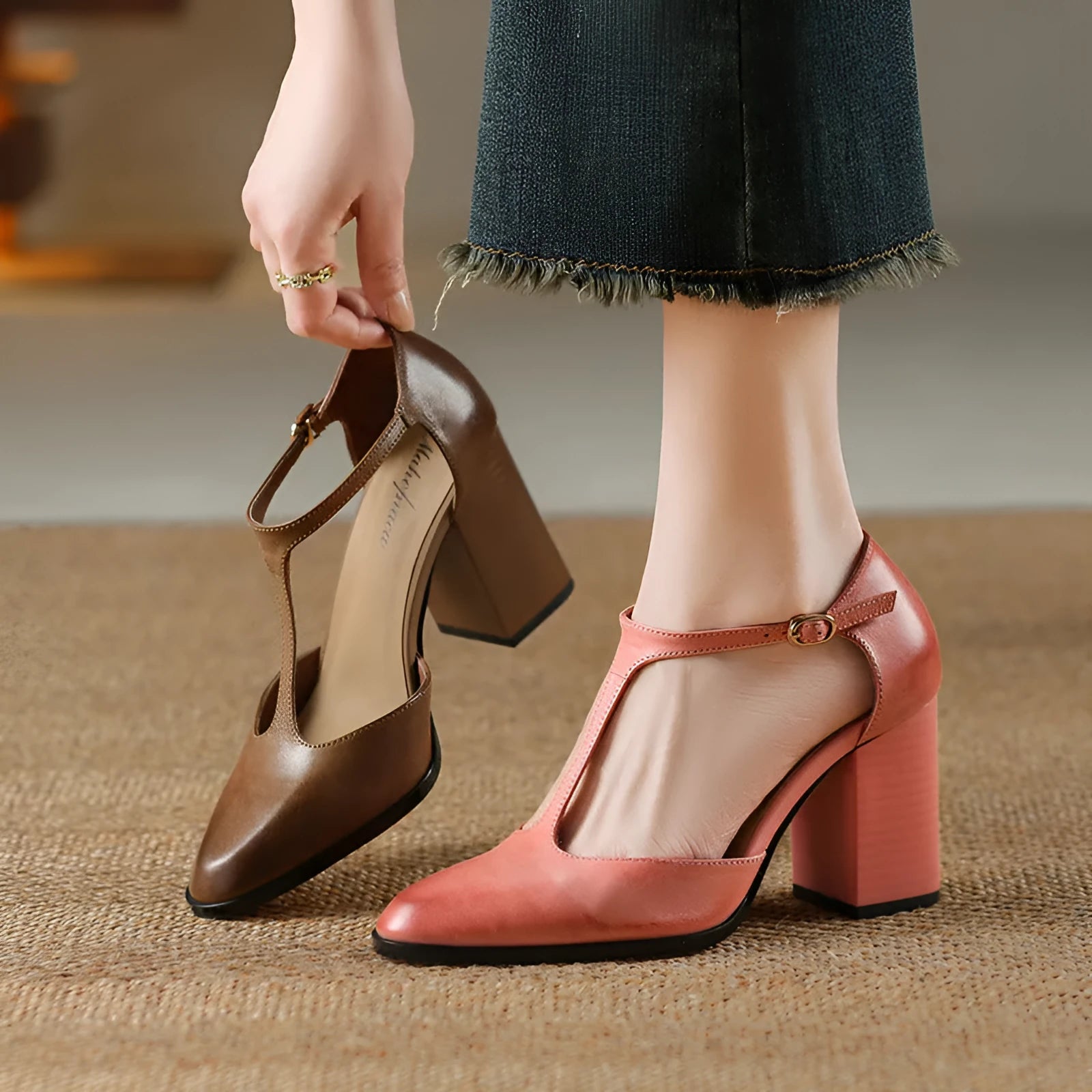 Women's dark brown retro pointed Mary Jane shoes with a hollow toe design and a buckle fastening.
