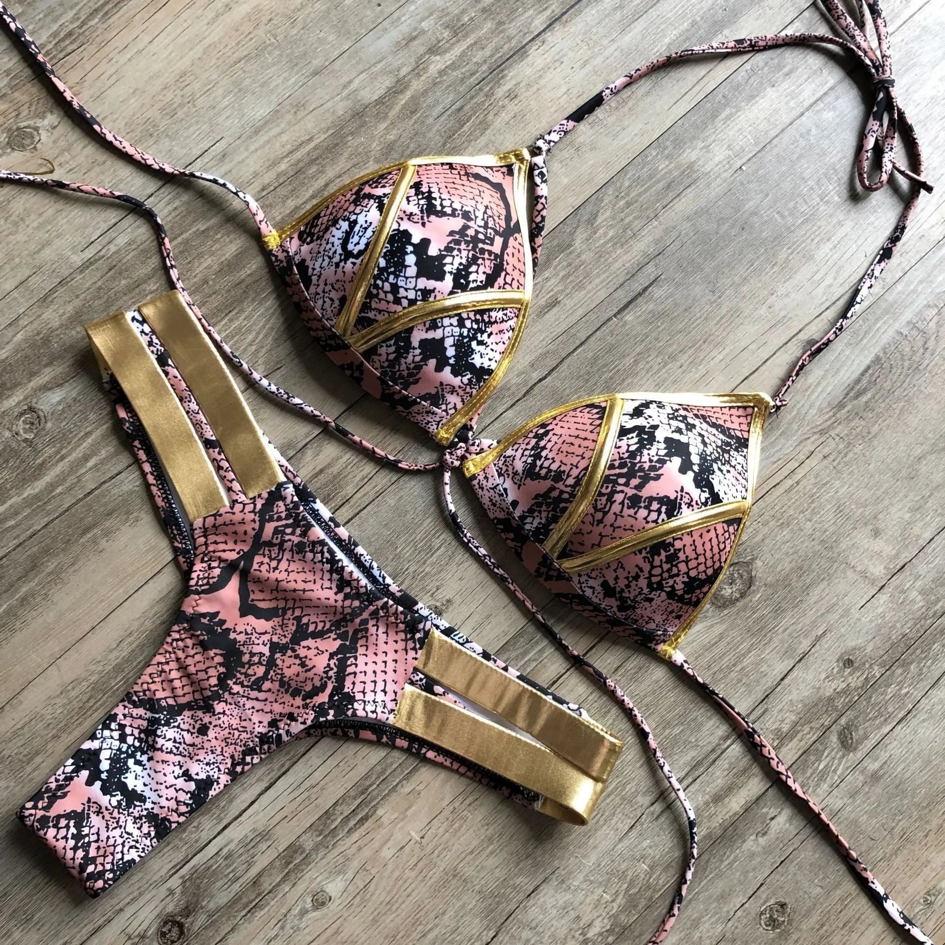Women's bronzing bikini swimwear with padded cups, shown in a colour option like leopard print.
