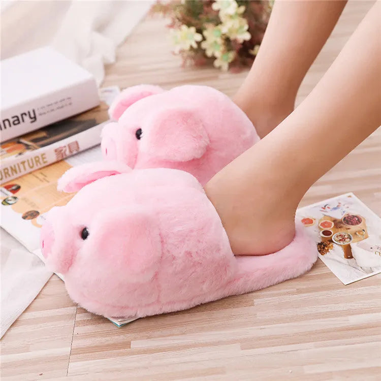Pink pig floor slippers with short plush fabric and PP cotton filling.