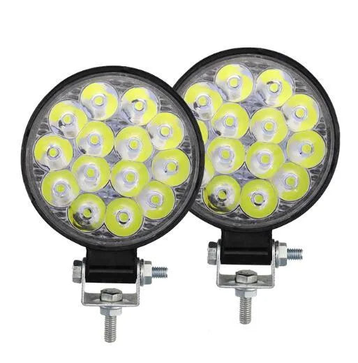Mini round aluminium car LED work light with white light, shown for off-road vehicle installation.