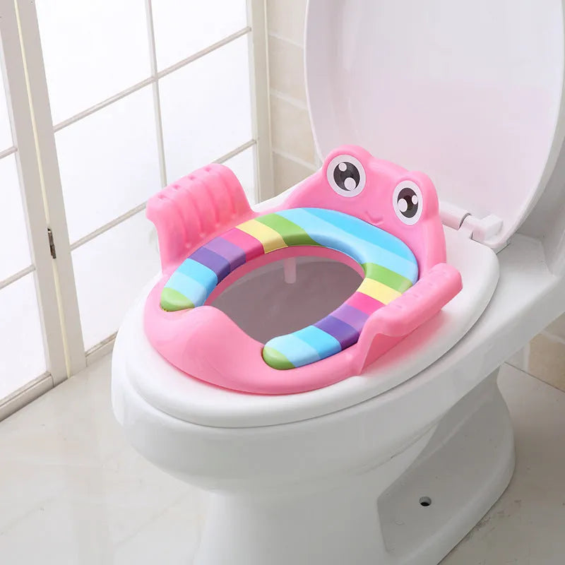 Pink baby toilet seat with adjustable non-slip pads for toddlers aged 1-6 years on a toilet bowl