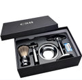 CSB men's shaving set with chrome stand, badger hair brush, double edge razor, zinc bowl, and blades in a black box.