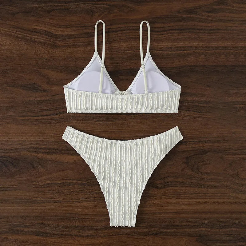 Women's white V-neck two-piece swimsuit set with sleeveless top and shorts on a mannequin.