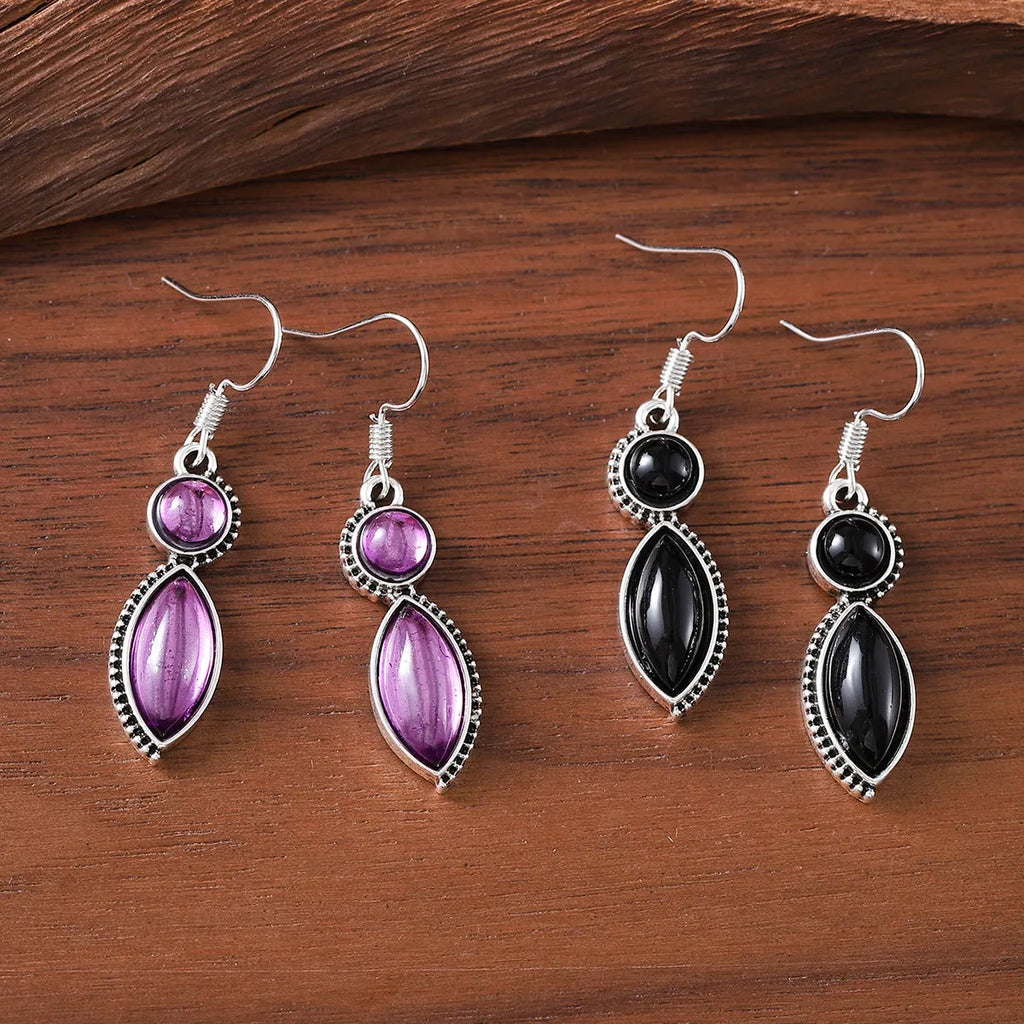Geometric vintage earrings with black and purple gemstone accents in bohemian style