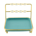Modern cosmetics storage rack in army green iron art and ceramic on desktop with makeup brushes
