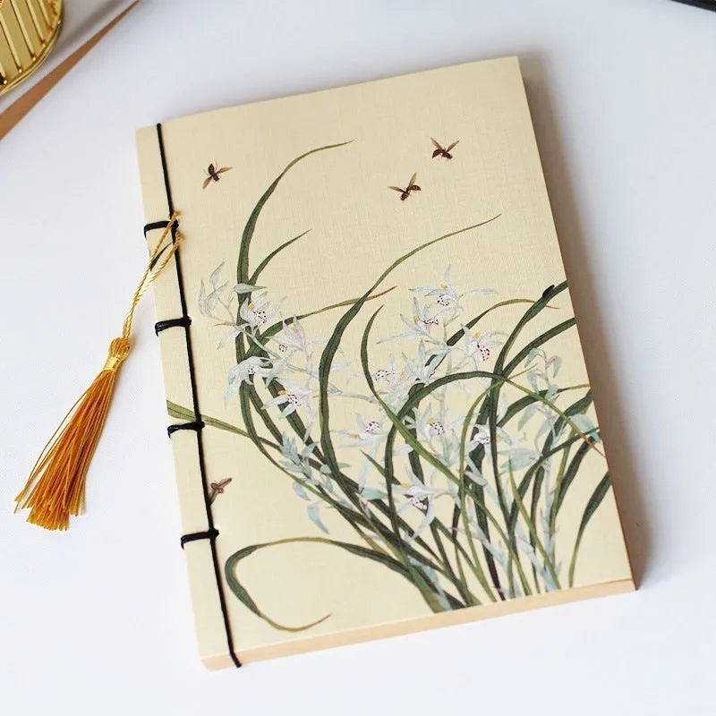 A5 antique thread-bound notebook with embossed cover and decorative tassels